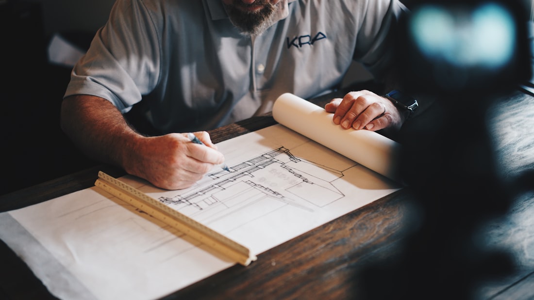 Greystone Construction team reviewing architectural plans